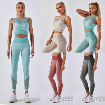 Traje de yoga de pantalones de fitness de chaleco hueco sin costuras de punto